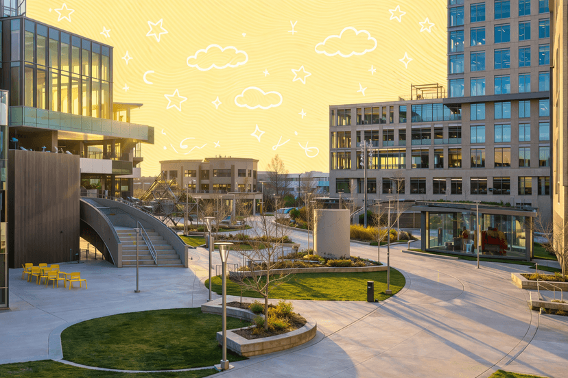 Sunrise over modern office buildings and landscaped green spaces in a Boise business district.