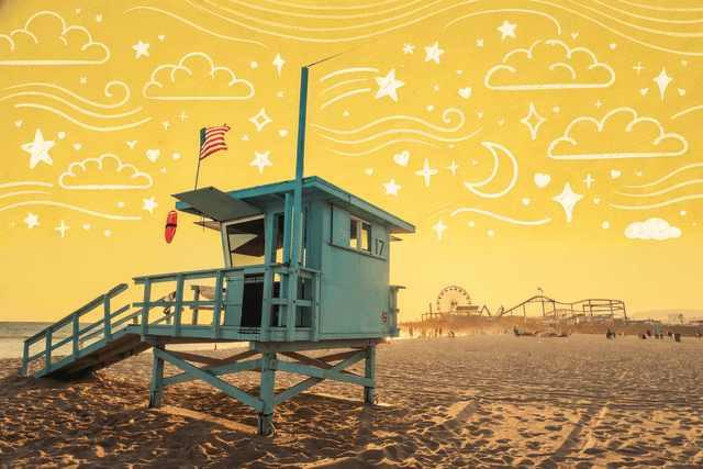 Lifeguard tower on Santa Monica Beach at sunset with the Santa Monica Pier in the background, highlighting coastal lifestyle and neighborhood life in Santa Monica, California.