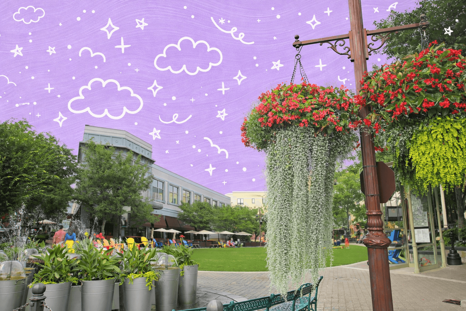 Neighborhood park plaza in Overland Park, Kansas with hanging flower baskets, green lawn space, and colorful outdoor seating near shops and restaurants.