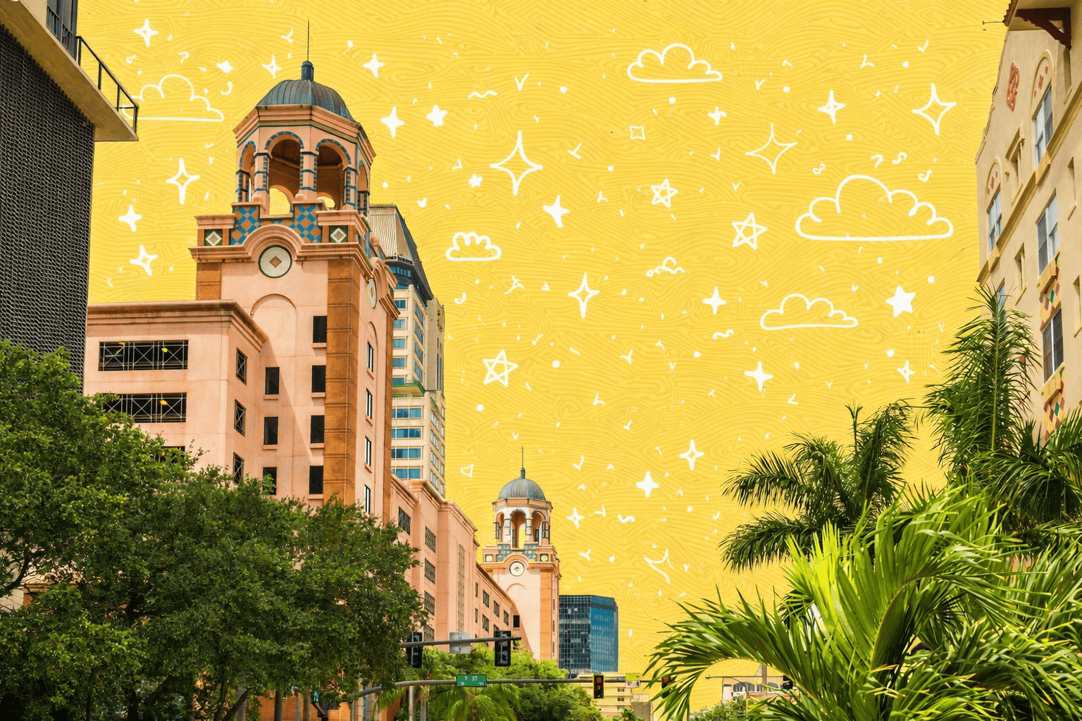 Downtown St. Petersburg Florida skyline with pink Mediterranean style tower buildings and palm trees.