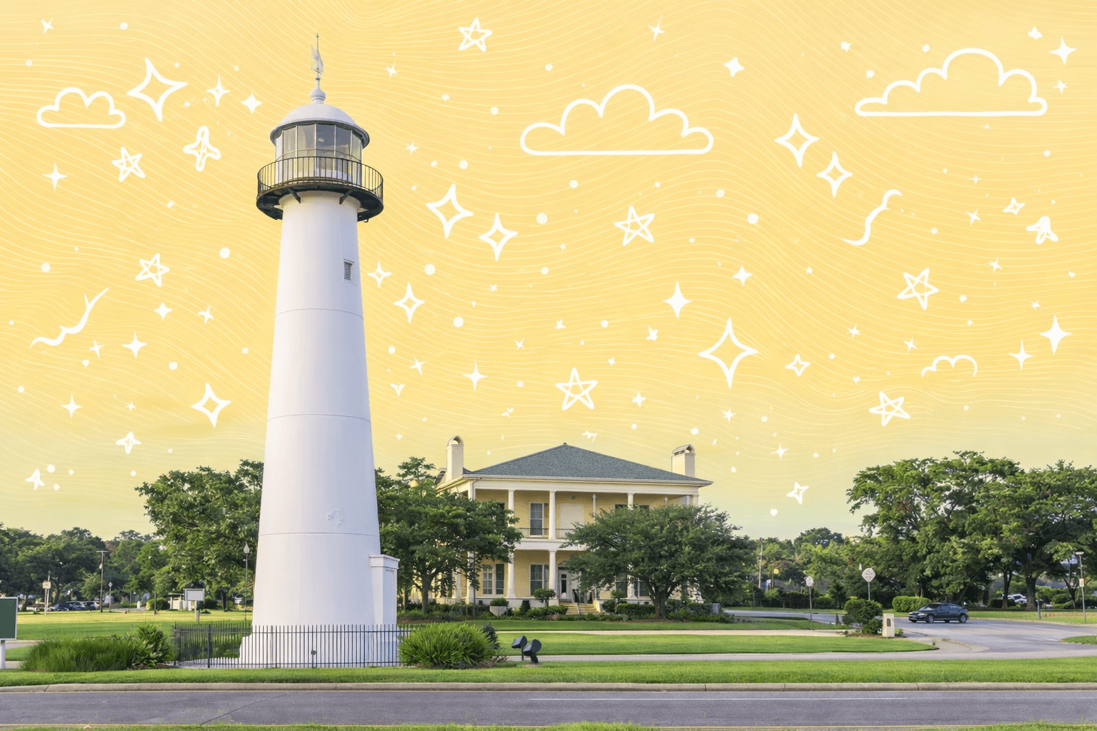 Lighthouse and historic home in Biloxi, Mississippi, under a clear blue sky.