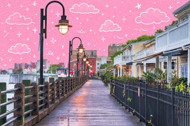 Norfolk, Virginia waterfront boardwalk with street lamps and historic homes.