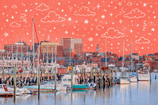 Waterfront marina with sailboats and fishing boats in Portland, Maine, showcasing the city skyline and coastal neighborhood lifestyle.