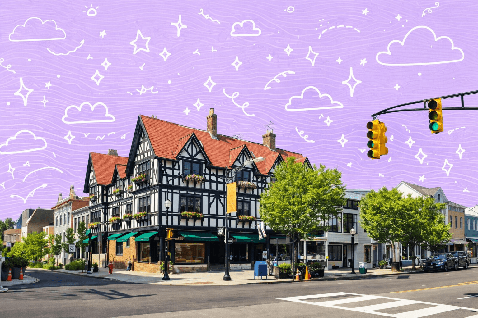 Charming Tudor-style building in Princeton, NJ under a clear blue sky, with traffic lights and surrounding greenery.