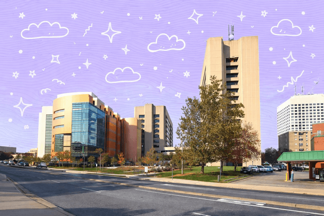 Modern buildings in Rockville, MD under a clear blue sky.